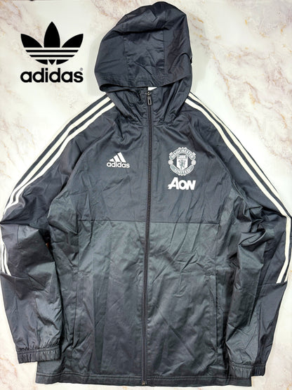 【adidas × Manchester United】マンチェスター・ユナイテッド AON スポンサーロゴ入り ウィンドブレーカー パーカー ブラック Lサイズ相当